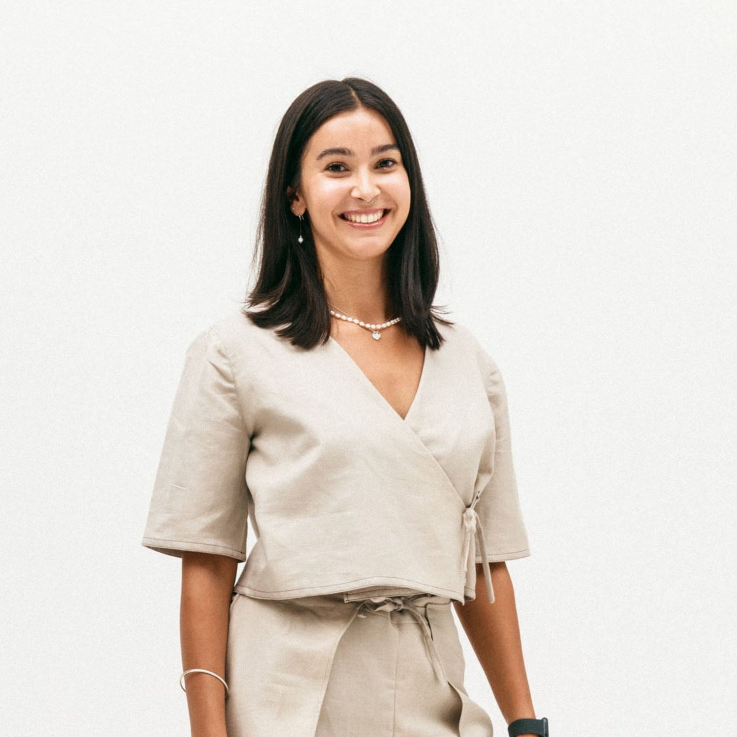 ziyou founder wearing the koa tee beige outfit on a white background